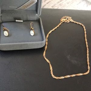 Cute detailed earrings and a gold anklet.